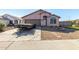 Charming single-story home featuring a well-maintained landscape and a spacious driveway at 16150 N 86Th Ave, Peoria, AZ 85382