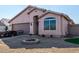 Inviting single-story home with a well-manicured lawn, two car garage, and desert landscaping at 16150 N 86Th Ave, Peoria, AZ 85382