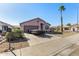 Attractive home with desert landscaping, a private yard, and a mature shade tree at 16150 N 86Th Ave, Peoria, AZ 85382