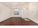Bright living room with wood floors, neutral walls, and plenty of natural light at 16150 N 86Th Ave, Peoria, AZ 85382