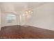 Bright living room with wood floors, neutral walls, and plenty of natural light at 16150 N 86Th Ave, Peoria, AZ 85382