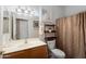 Bathroom featuring a single sink vanity, toilet, and bathtub with shower at 16160 W Starlight Dr, Surprise, AZ 85374