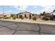 Attractive single-story home with desert landscaping, solar panels, and charming curb appeal at 16160 W Starlight Dr, Surprise, AZ 85374