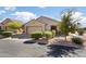 Charming single-story home featuring a two-car garage, desert landscaping, and well-maintained curb appeal at 16160 W Starlight Dr, Surprise, AZ 85374