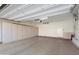 A spacious two-car garage features a wall of storage cabinets and an automatic door for easy access at 16160 W Starlight Dr, Surprise, AZ 85374