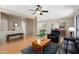 Open-concept living area showcasing wood floors and seamless transitions to the dining and kitchen spaces at 16160 W Starlight Dr, Surprise, AZ 85374