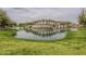 Asante community bridge over water with palm trees and landscaping at 16526 W Calle Lejos --, Surprise, AZ 85387