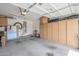 Spacious garage with built-in cabinets, offering ample storage and organization for tools, equipment, and vehicles at 16526 W Calle Lejos --, Surprise, AZ 85387
