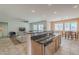 Bright kitchen with breakfast bar, open to living area, showcasing modern appliances and ample counter space at 16526 W Calle Lejos --, Surprise, AZ 85387