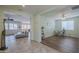Open-concept living area with tile flooring, comfortable seating, and views to other rooms at 16526 W Calle Lejos --, Surprise, AZ 85387
