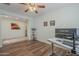 Inviting office space featuring wood floors, a ceiling fan, and ample natural light at 16526 W Calle Lejos --, Surprise, AZ 85387