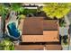 A bird's-eye view shows a backyard with a pool, lush landscaping and a patio area at 1683 W Maplewood St, Chandler, AZ 85286