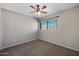 Bedroom featuring neutral tones, a ceiling fan and a sunny window at 1683 W Maplewood St, Chandler, AZ 85286