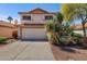 Charming two-story home featuring a two-car garage and vibrant desert landscaping in the front yard at 1683 W Maplewood St, Chandler, AZ 85286