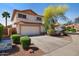 Charming two-story home featuring a two-car garage, lush landscaping, and a well-maintained yard at 1683 W Maplewood St, Chandler, AZ 85286