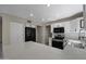 Modern kitchen featuring stainless steel appliances, white cabinets, and a spacious island at 1683 W Maplewood St, Chandler, AZ 85286
