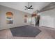 Open living room featuring tile flooring, high ceilings, neutral paint, and staircase to the second floor at 1683 W Maplewood St, Chandler, AZ 85286