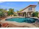 Backyard featuring a private pool, mature landscaping and a covered patio at 1683 W Maplewood St, Chandler, AZ 85286
