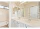 Bright bathroom featuring a double sink vanity and a combined tub and shower at 17458 W Wandering Creek Rd, Goodyear, AZ 85338