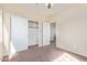 Bedroom features a closet for storage and neutral walls, creating a cozy space at 17458 W Wandering Creek Rd, Goodyear, AZ 85338
