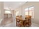 Inviting dining area with wood table, chairs, and ample natural light at 17458 W Wandering Creek Rd, Goodyear, AZ 85338