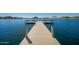 Inviting community dock with benches offering scenic lake views, perfect for relaxation at 17458 W Wandering Creek Rd, Goodyear, AZ 85338