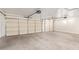 Spacious garage with multiple doors and high ceilings, offering ample parking and storage at 17458 W Wandering Creek Rd, Goodyear, AZ 85338