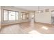 Bright, open living room features light floors, large windows, and seamlessly connects to other spaces at 17458 W Wandering Creek Rd, Goodyear, AZ 85338
