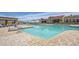 Resort-style pool with comfortable lounge chairs and a covered patio for relaxation and socializing at 17458 W Wandering Creek Rd, Goodyear, AZ 85338