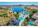 Aerial view showcasing the community waterpark with slides, pools, and a splash pad for Gathering fun at 17458 W Wandering Creek Rd, Goodyear, AZ 85338