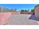Backyard with a stone landscape and fenced in perimeter at 1778 E Bishop Pl, Casa Grande, AZ 85122