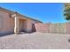 A private backyard space with a brick wall and gravel ground cover is perfect for outdoor living at 1778 E Bishop Pl, Casa Grande, AZ 85122