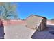 View of backyard featuring detached storage shed and neutral-colored gravel at 1778 E Bishop Pl, Casa Grande, AZ 85122