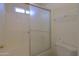 Bathroom featuring a shower-tub combination with frosted glass doors at 1778 E Bishop Pl, Casa Grande, AZ 85122