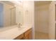 Bright bathroom featuring a large mirror and walk-in closet for ample storage at 1778 E Bishop Pl, Casa Grande, AZ 85122