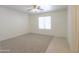 Cozy bedroom with a ceiling fan, carpet flooring, and natural light from the window at 1778 E Bishop Pl, Casa Grande, AZ 85122