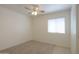 Comfortable bedroom with carpet, a ceiling fan, and a bright window at 1778 E Bishop Pl, Casa Grande, AZ 85122