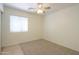 Bedroom with carpet floors and a window at 1778 E Bishop Pl, Casa Grande, AZ 85122