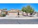 Charming single-story home with a well-manicured yard, desert landscaping, and a two-car garage at 1778 E Bishop Pl, Casa Grande, AZ 85122