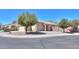 A tan single-story home features desert landscaping and a well-kept yard in a quiet neighborhood at 1778 E Bishop Pl, Casa Grande, AZ 85122
