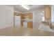Bright kitchen with white appliances, light wood cabinets and view of an additional room at 1778 E Bishop Pl, Casa Grande, AZ 85122