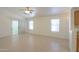 A spacious room offers tile flooring, large windows, and a sliding glass door for seamless indoor-outdoor living at 1778 E Bishop Pl, Casa Grande, AZ 85122