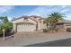 Inviting single-story home with a two-car garage, desert landscaping, and a neutral stucco facade at 17806 N Becke Ln, Surprise, AZ 85374