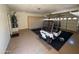 Garage showcases a golf cart, water heater, epoxy flooring, storage cabinets, and utility access at 17806 N Becke Ln, Surprise, AZ 85374