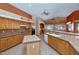 Spacious open kitchen features ample counter space, light wood cabinets, and a tile backsplash at 17806 N Becke Ln, Surprise, AZ 85374