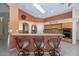 A spacious kitchen with a breakfast bar, modern appliances, and ample cabinet space offers a great area for cooking at 17806 N Becke Ln, Surprise, AZ 85374