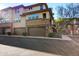 Exterior view of townhome showing attached garages and balcony at 17850 N 68Th St # 1037, Phoenix, AZ 85054