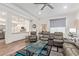 Spacious living room with open access to the kitchen, featuring modern furnishings and decor at 17850 N 68Th St # 1037, Phoenix, AZ 85054