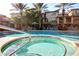 Community pool and spa area featuring lounge chairs and well-maintained landscaping at 17850 N 68Th St # 1037, Phoenix, AZ 85054