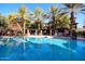 Gorgeous community pool area, lined by palm trees, offering plenty of seating and shade at 17850 N 68Th St # 1037, Phoenix, AZ 85054